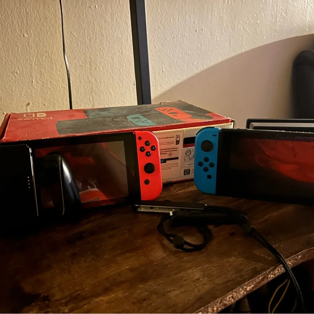 Nintendo Switch Console with Red and Blue Joy-Con Controllers